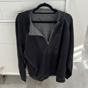 A reversible, black and gray quarter zip Tommy Bahama pull over pull over